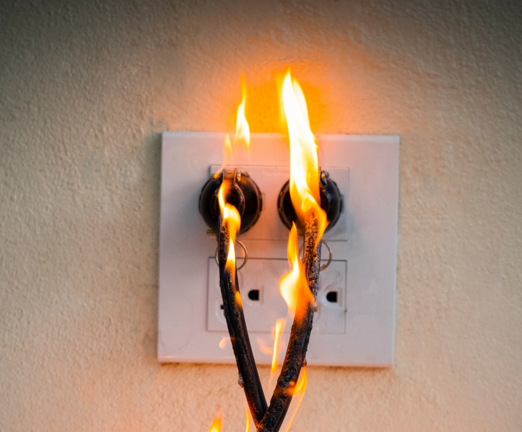 Sparking wires showing electrical fire risk from faulty wiring