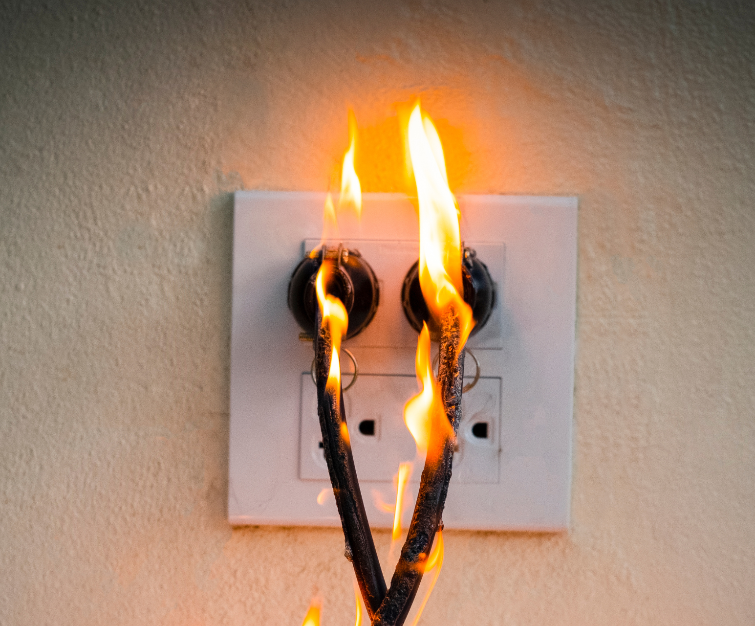 Sparking wires showing electrical fire risk from faulty wiring